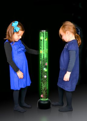 Image of 2 girls standing with a bubble tube with fish