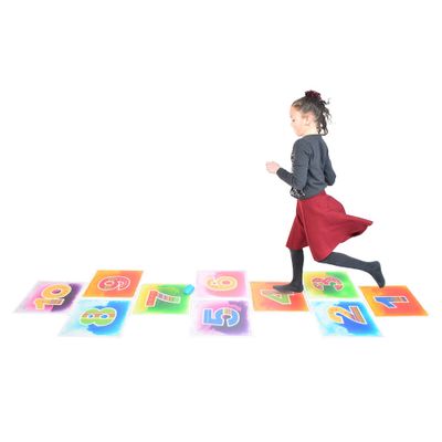 Image of child jumping on hopscotch liquid floor tiles