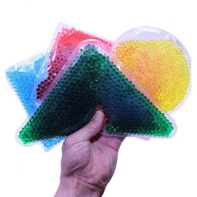 Image of a hand holding 4 sensory soft bead filled squidgy shapes