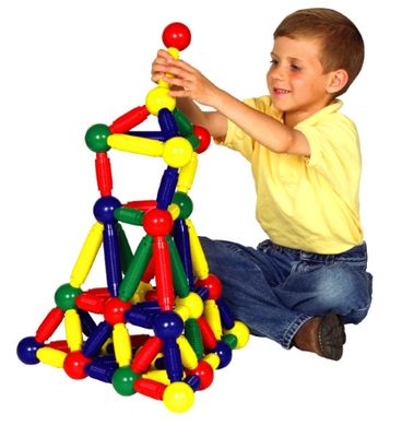 Child playing with junior jumbo magnetic building set