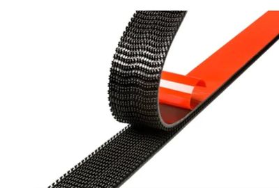 Two black industrial velcro strips interlocked