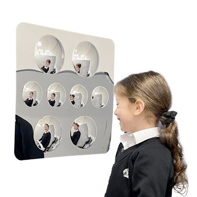 Image showing a girl smiling into 8 convex bubble mirror