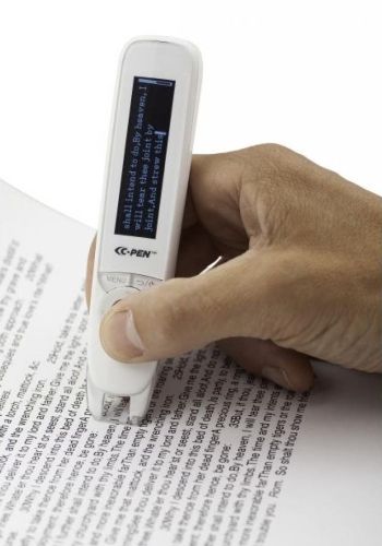 A hand scanning a line of text with a white C-Pen 2