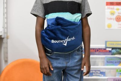 Image of a boy wearing a  Handy Hugger around his waist.