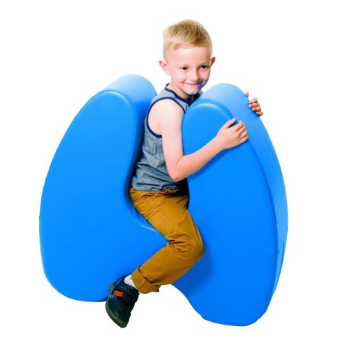Image of boy sitting astride a Squeeze seat