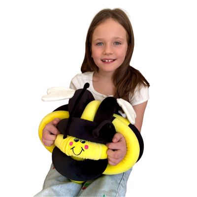 Image of child holding vibrating cuddle bee