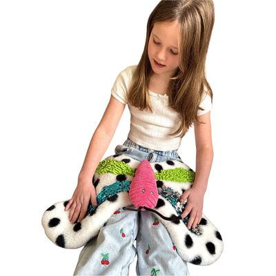 Image of child sitting with a Butterfly Tactile Weighted Pad on her lap