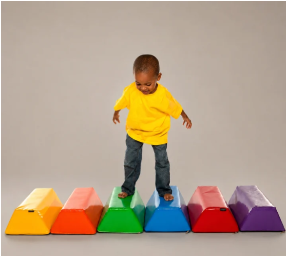 Image of child standing on stepping stones set laid out in a row