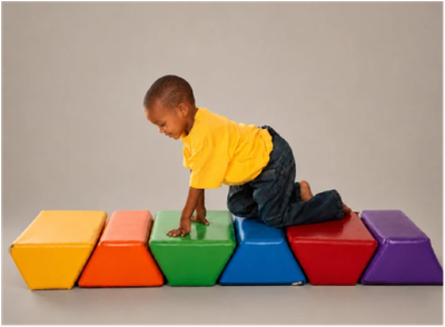 Image of a child crawling on stepping stones set laid out in a row