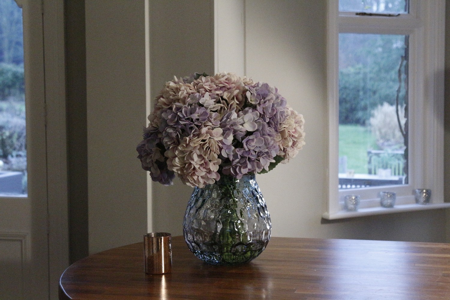 Ball of Hydrangeas in a Large Textured Coral Vase- Lilac and Pink Ball of Hydrangeas in a Large Textured Coral Vase- Lilac and Pink
