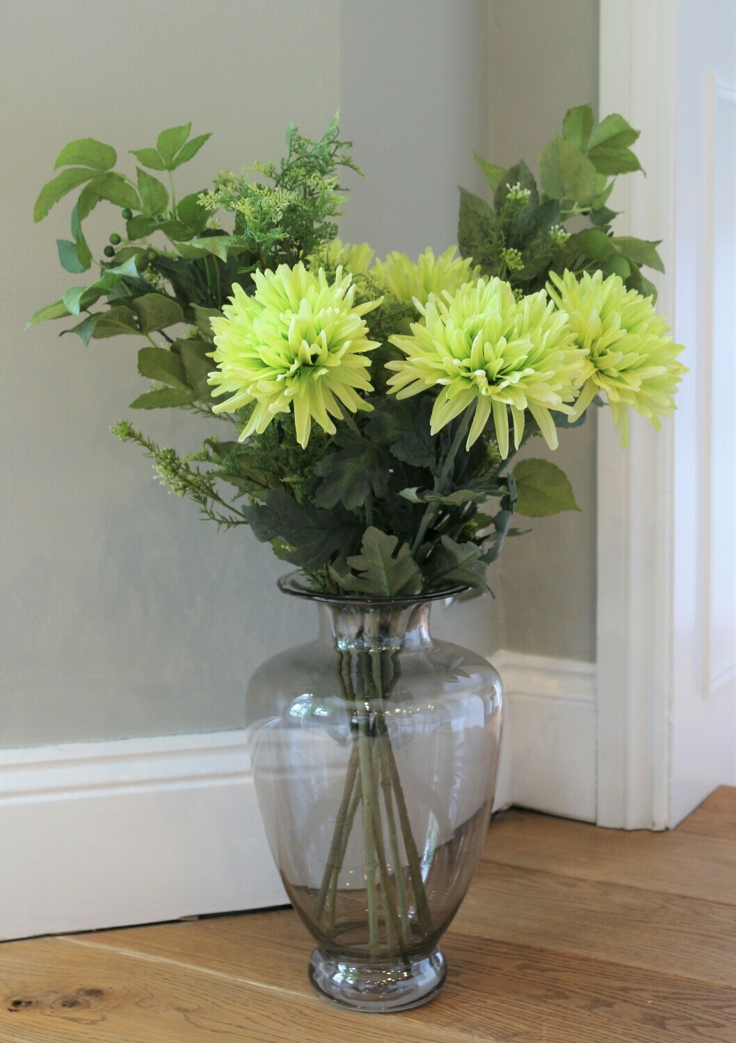 Artificial Chrysanthemum bouquet and foliage in a grey grecian vase