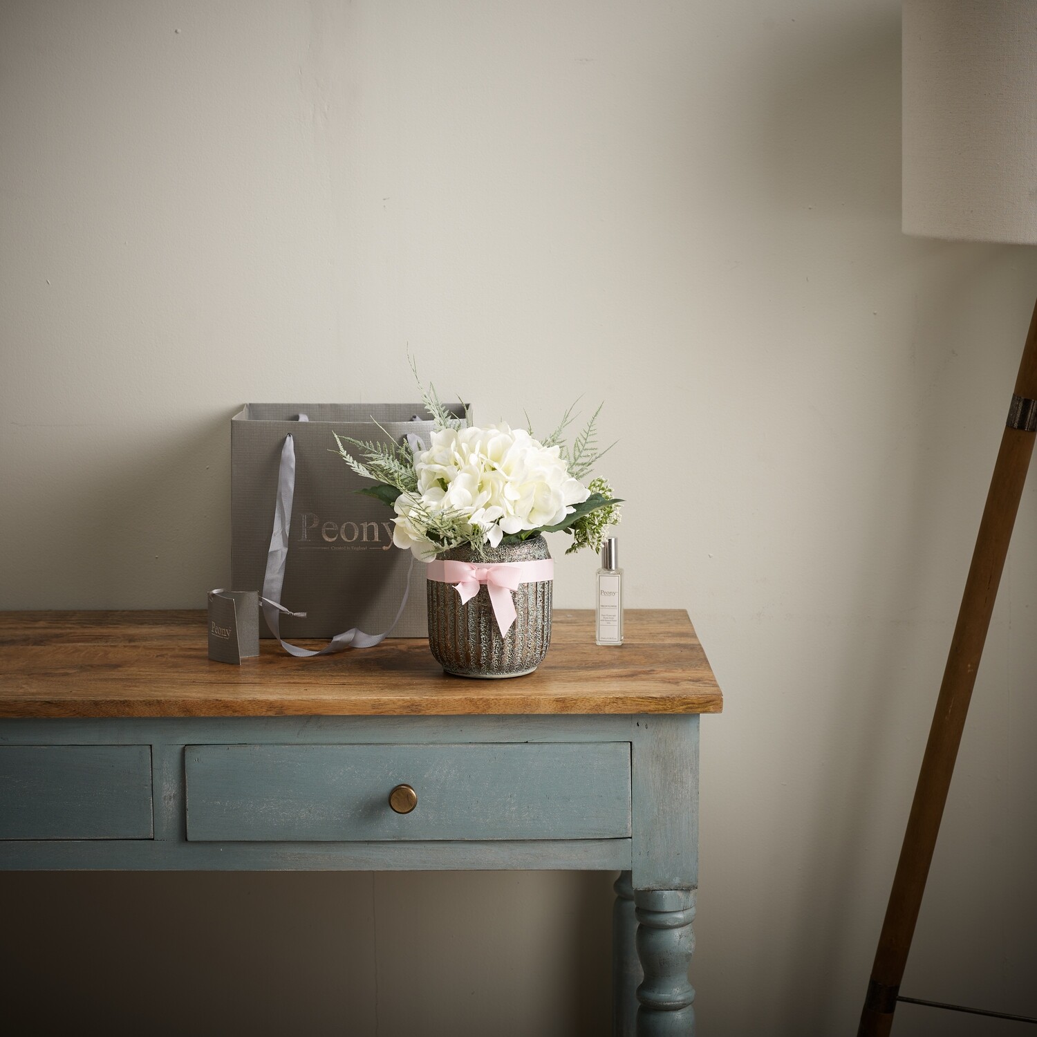 Hydrangeas and Foliage in a textured Pot with a Bow Hydrangeas and Foliage in a textured Pot with a Bow