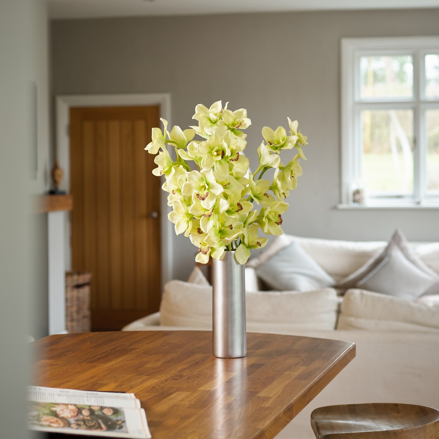 Cymbidium Orchids in a Silver Ceramic Cylinder Cymbidium Orchids in a Silver Ceramic Cylinder
