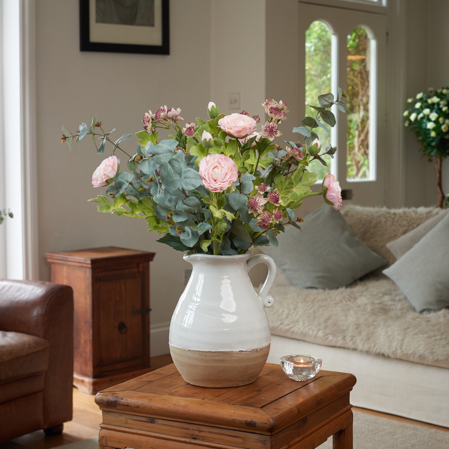 Ranuncula, Eucalyptus and Astrantia in Large Two-Toned Jug Ranuncula, Eucalyptus and Astrantia in Large Two-Toned Jug