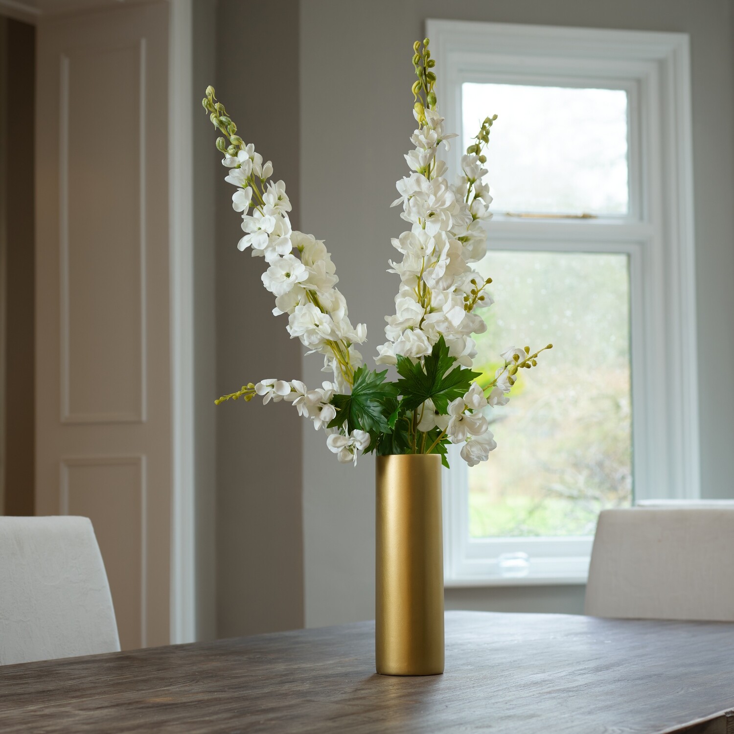 Delphiniums in a Gold Ceramic Cylinder Delphiniums in a Gold Ceramic Cylinder