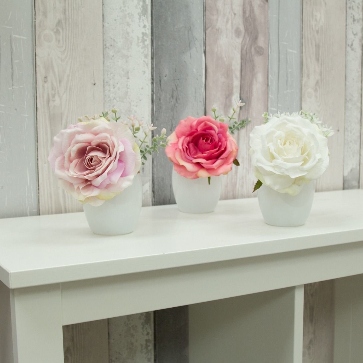 Artificial Roses & Foliage in white vases with a gold rim-Set of 3 (includes gift bags) - Mixed colours Artificial Roses & Foliage in white vases with a gold rim-Set of 3 (includes gift bags) - Mixed colours