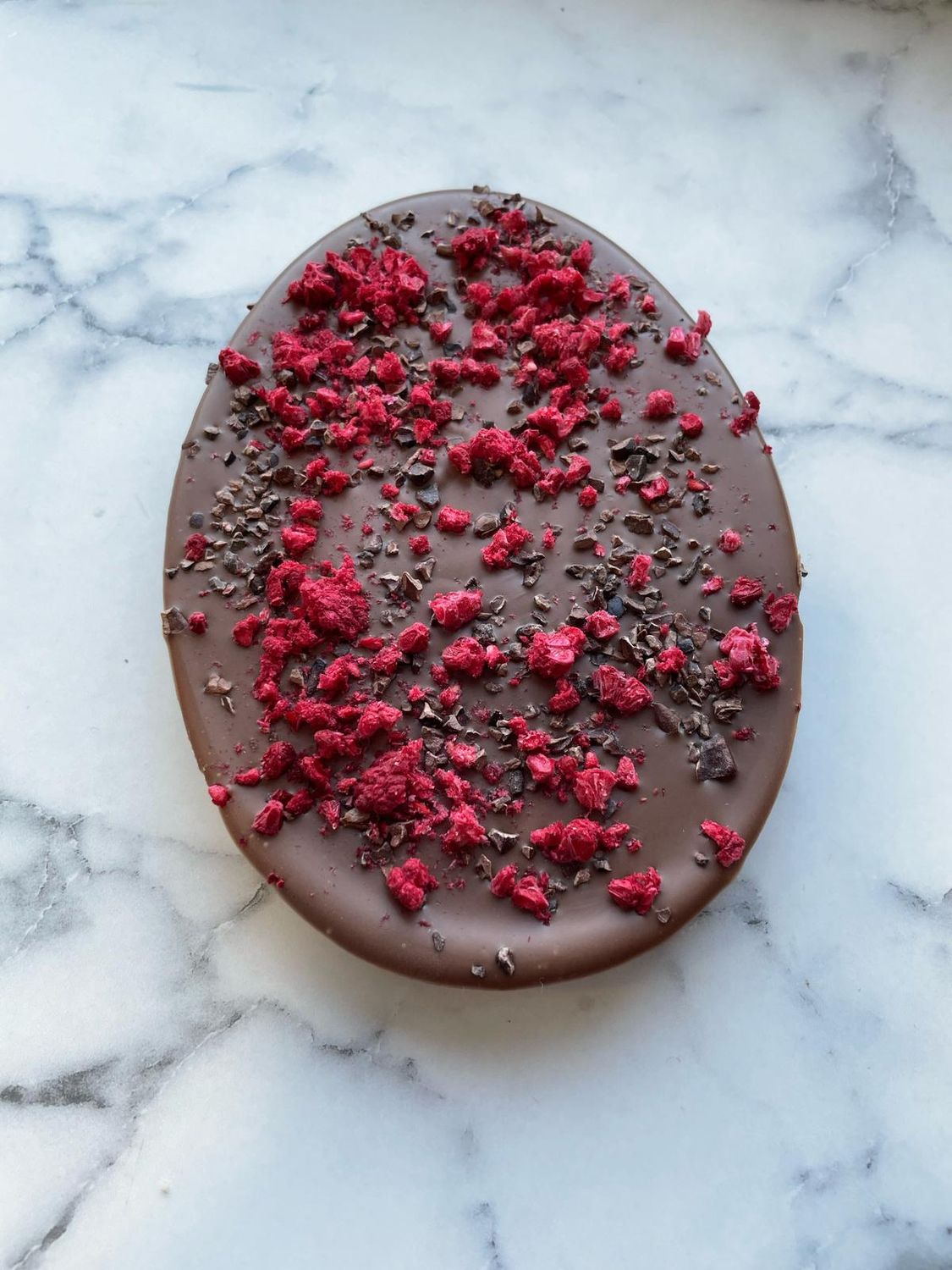 Milk Chocolate Egg with Cacao nibs and Raspberry