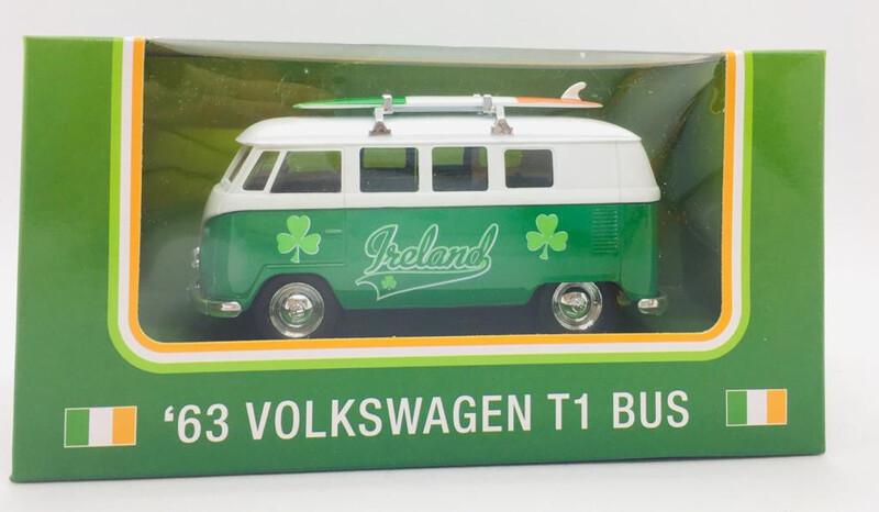 Volkswagen Bus T 1 Model 1963 With A Surfboard On It’s Roof