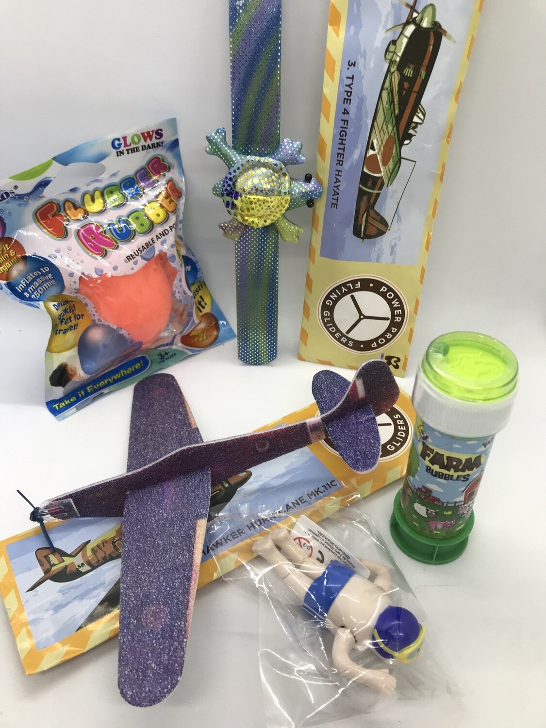 Pocket Money Collection Clock Work Boy Swimmer, Snap Bracelet, Farm Bubbles, 2 Polystyrene Plane Gliders and a Glow in the Dark Flubber Rubber Balloon/Ball