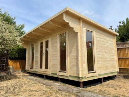 side view of Blakey log cabin