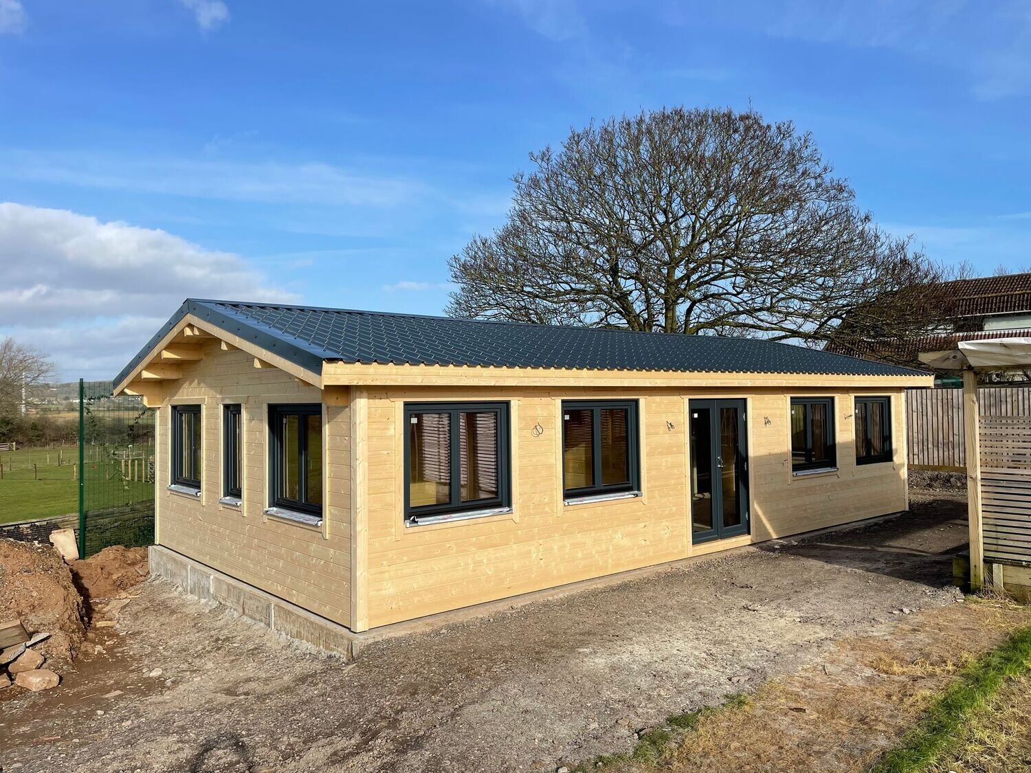 Canterbury 2 Bedroom Fully Insulated Log Cabin | 68mm Logs + 100mm Insulation + 28mm Cladding | 11.2 x 6.2m | Bespoke Range | Winter Pack Included