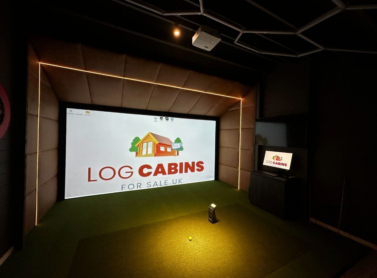 The Golfy McGolf Face Golf Cabin | 5.0 x 4.5m - Golf Simulator Log Cabin | 44mm or 68mm Thick Logs | BESPOKE The Golfy McGolf Face Golf Cabin | 5.0 x 4.5m - Golf Simulator Log Cabin | 44mm or 68mm Thick Logs | BESPOKE