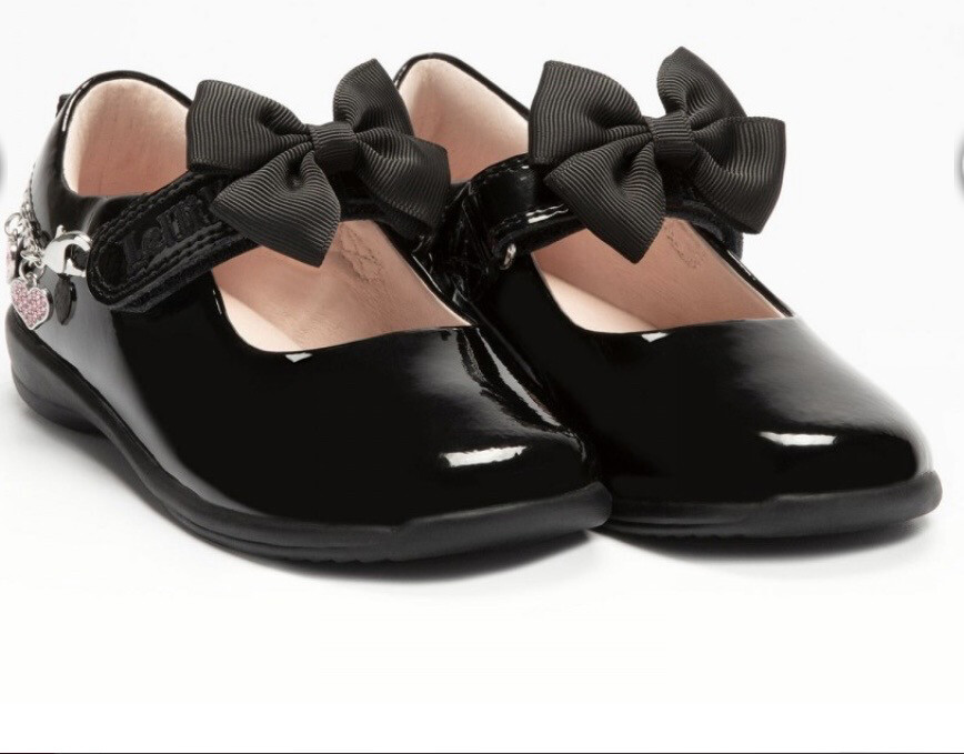Black Patent Shoe With Charm And Bow Detail