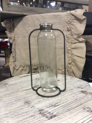 glass vase in metal stand