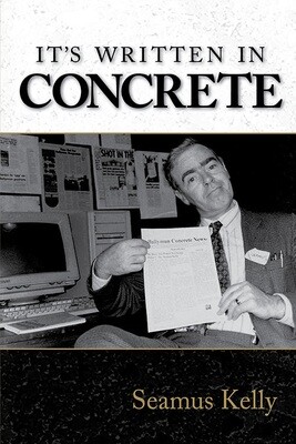 Front cover of It's Written in Concrete by Seamus Kelly featuring a photograph of the author, holding up a copy of the inaugural issue of Ballymun Concrete News.