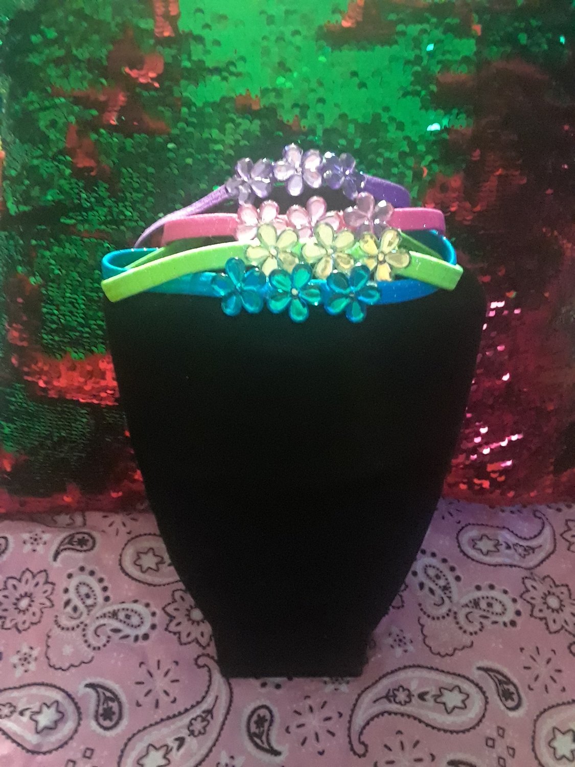 Set of four flower headbands. Colors purple,pink,bright blue and lime green.Ask about bulk sales and pricing. Ladies and little girls! Age wise toddler to adult.