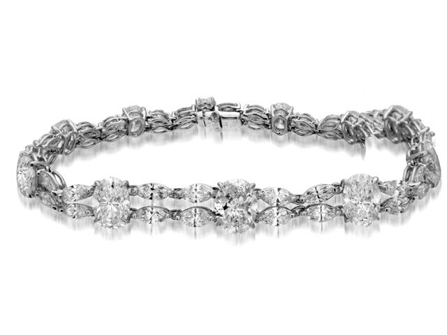 PLATINUM & 18K W/G OVAL DIAMOND BRACELET