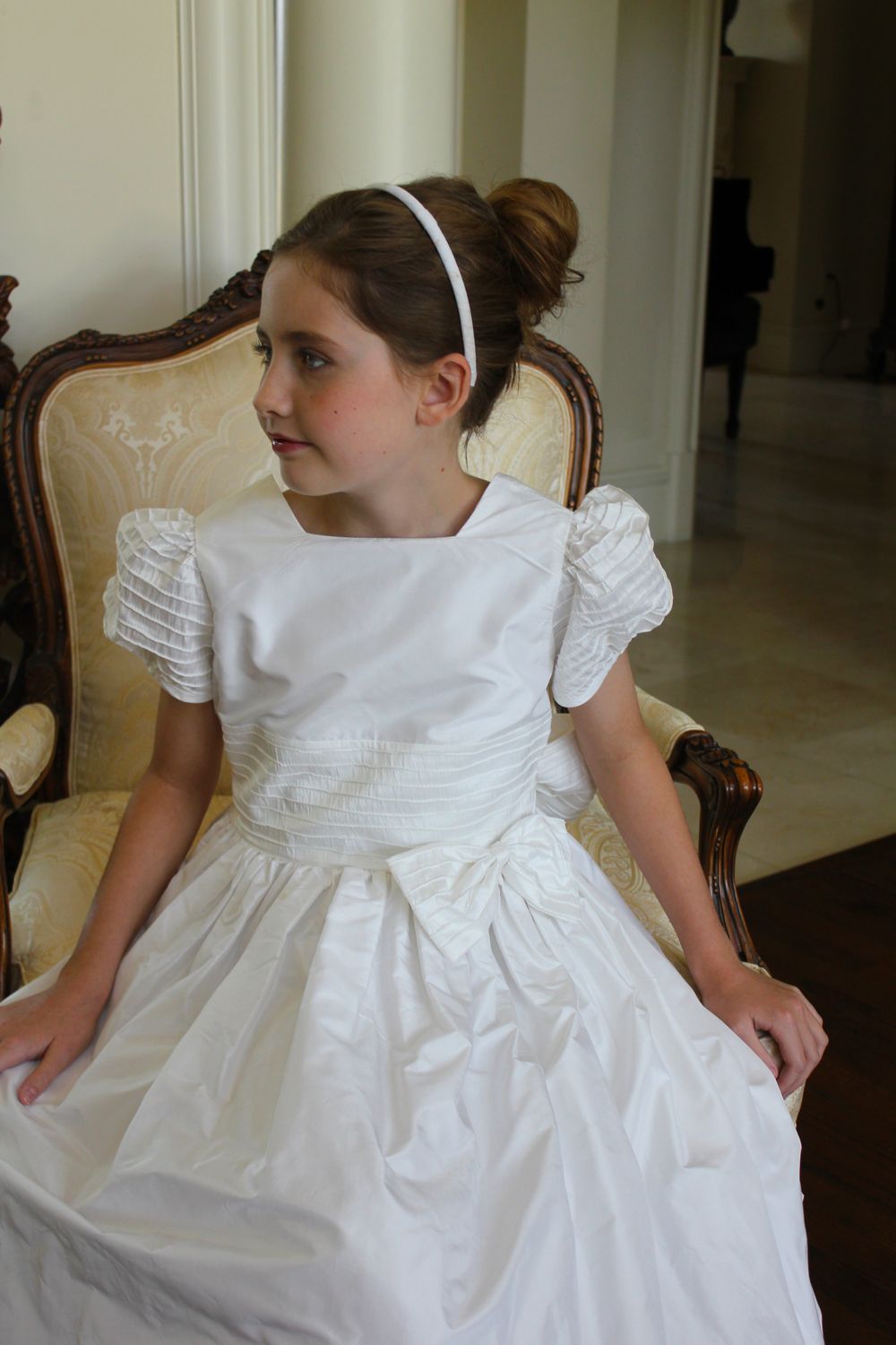 Silk flower girl dress with pintucked puff sleeves and waistline, finished with a bow — perfect for weddings or portraits