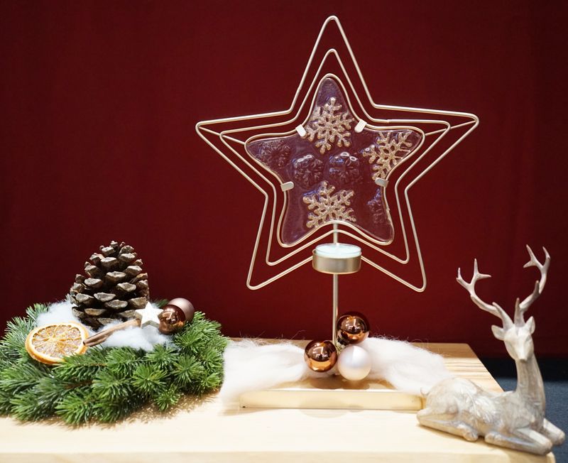 Teelicht mit integrierten Glasstern