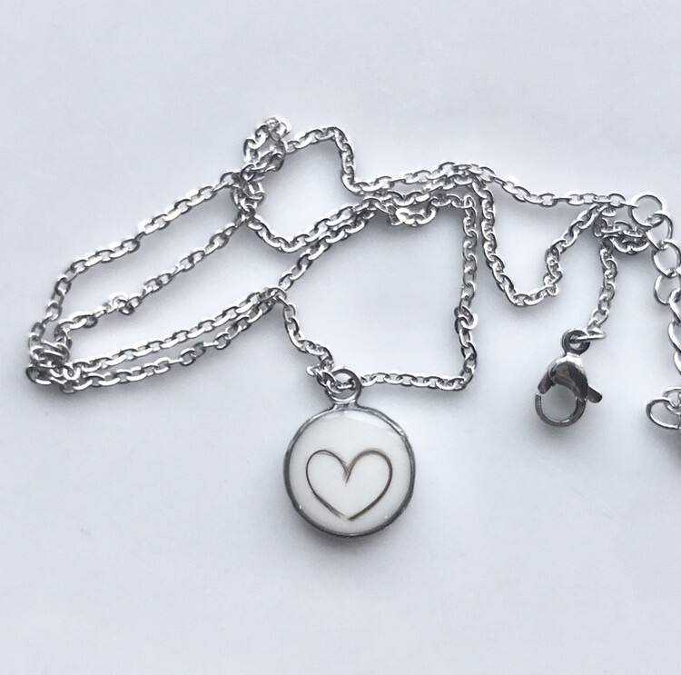 Necklace with breast milk and baby hair pendant