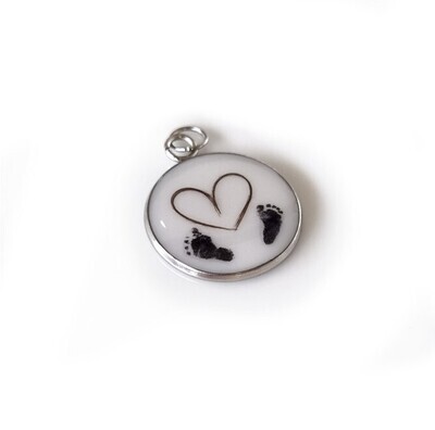 Breast milk, baby hair, footprint and name pendant.
