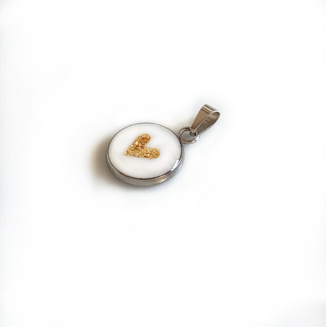 Breast milk pendant with gold leaf heart