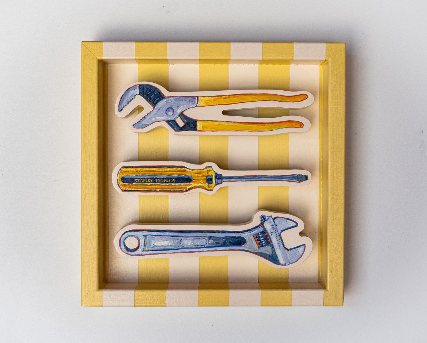 Wrenches and Screwdriver on Cream & Butter