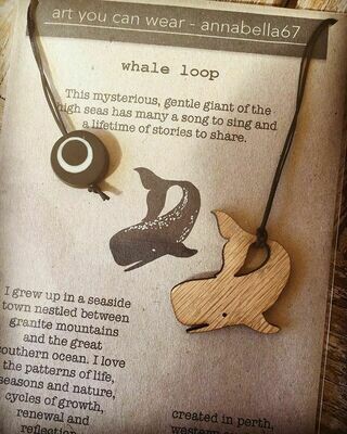 Whale Loop wood pendant on black waxed hemp