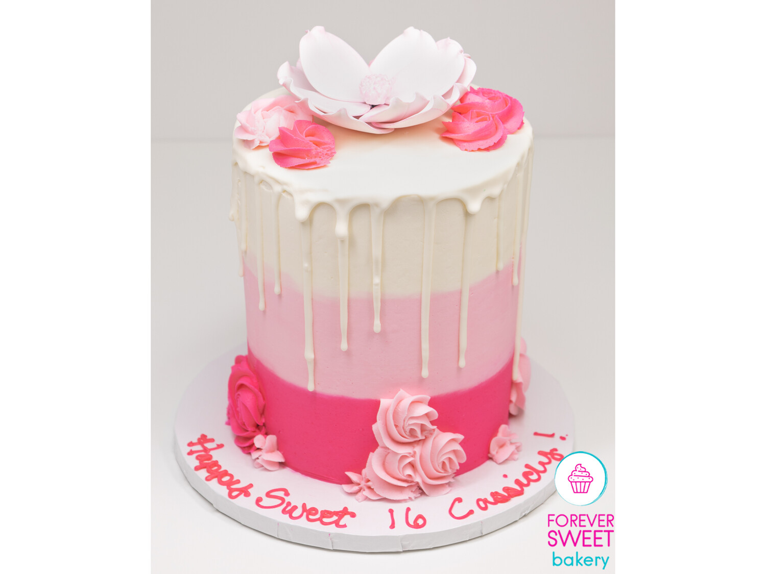 Double Barrel Pink and White Striped Magnolia Topped Cake