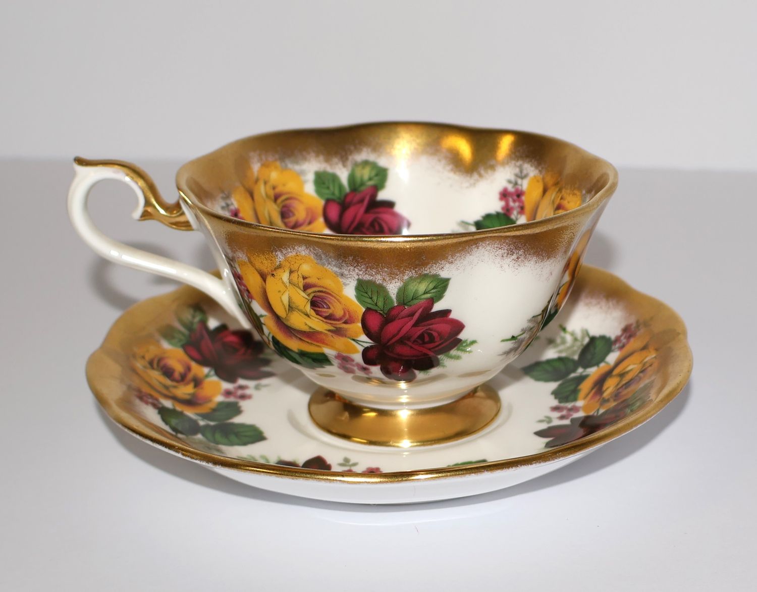 Royal Albert &quot;Treasure Chest Series&quot; Footed Cup &amp; Saucer – Red &amp; Yellow Roses Pattern