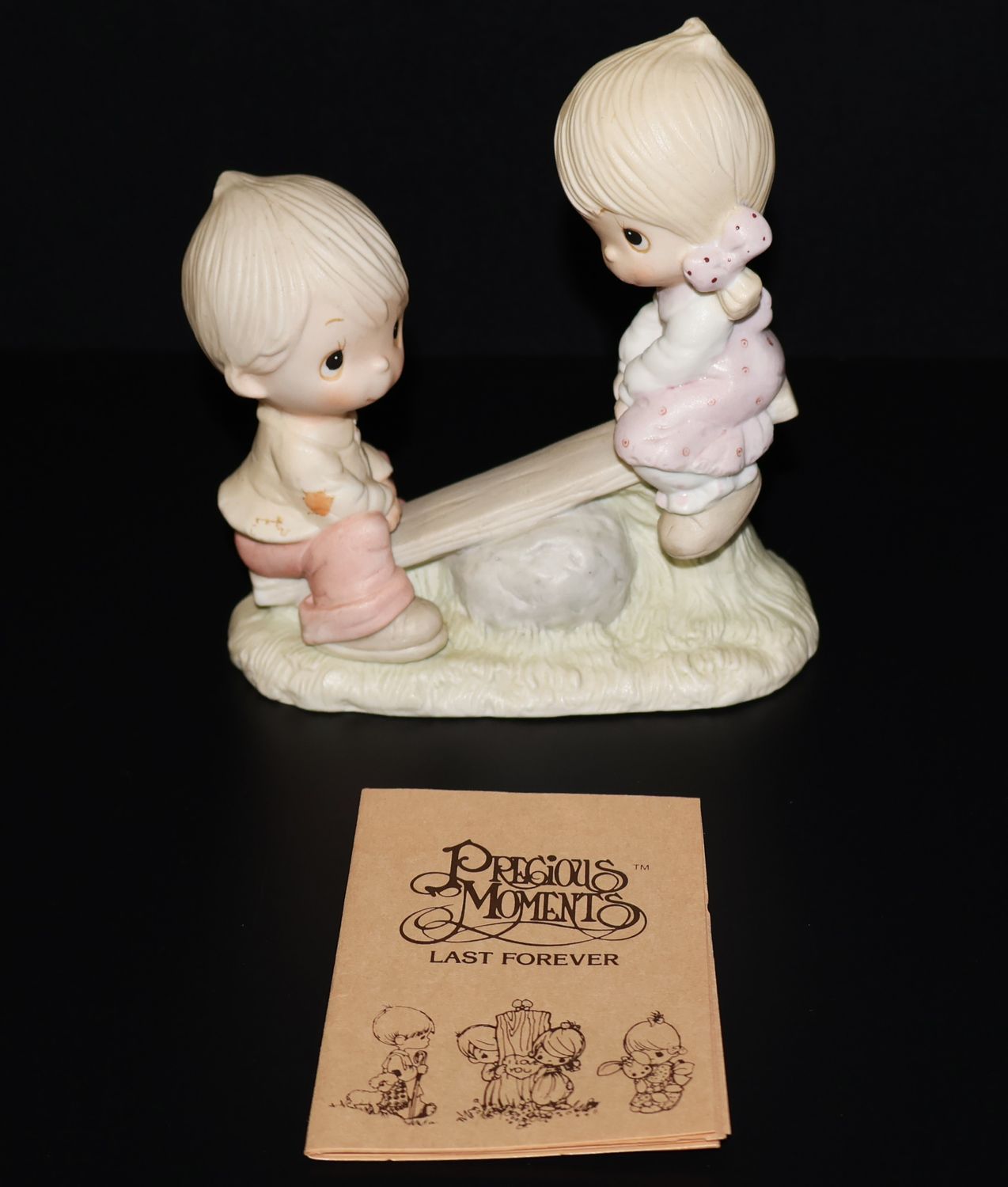 Precious Moments 1977 Figurine – “Love Lifted Me” (Girl &amp; Boy on Seesaw)