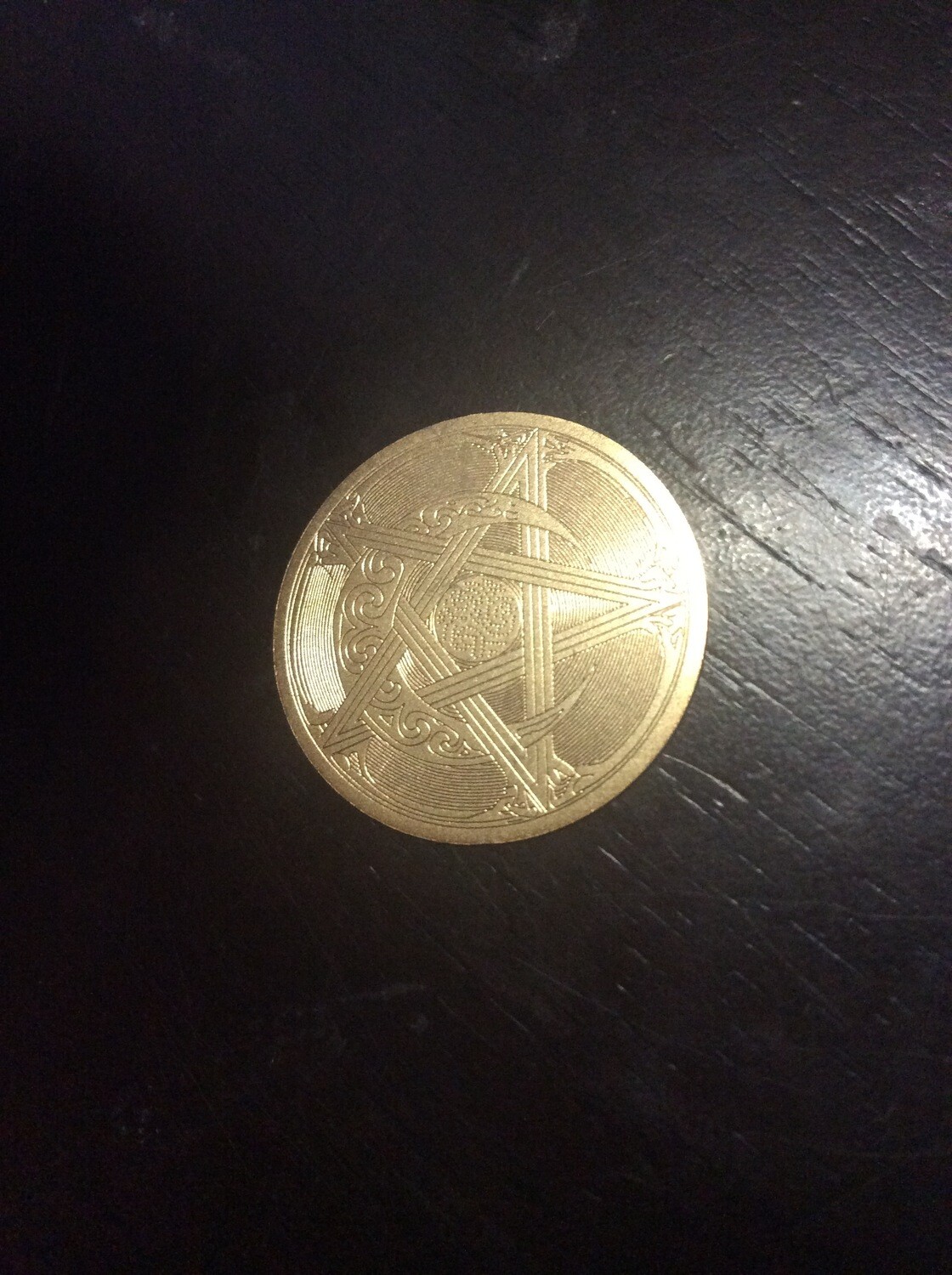 small medallion enchanted to increase effects of spells cast