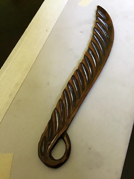 wooden carved feather hold while Casting Wishes unto Djinns, Amplify intent of wish to be granted, obediently, swiftly.