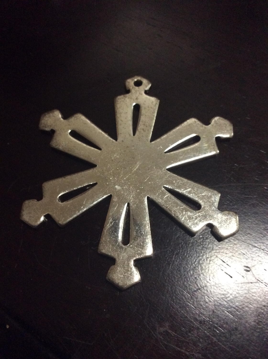 Metal Snowflake ornament emits essence of joy and happiness throughout Dwelling 