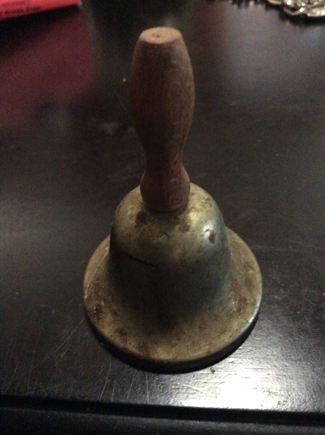 Small metal bell with wooden handle summons Fairies 