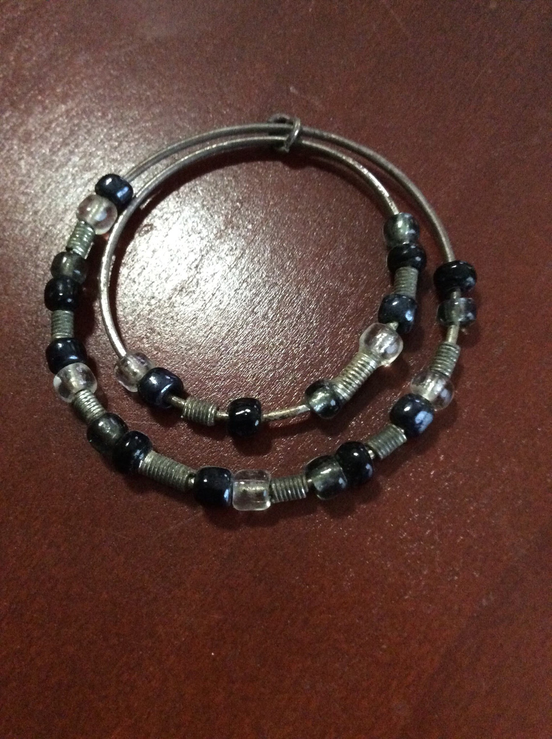Double loop beaded charm forbid any evil essences or negative energies from entering thy home 