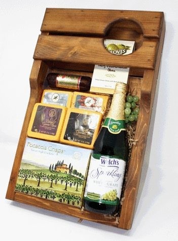Wooden wine tray with gourmet foods and Sparkling cider