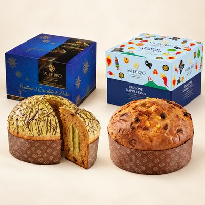 Sal De Riso Dubai Chocolate and Passione Napoletana panettone cakes with their matching blue gift boxes