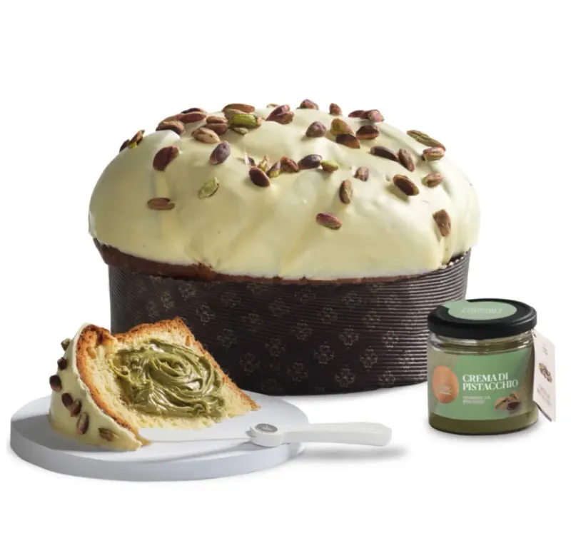 Fiasconaro Oro Verde panettone with white chocolate and pistachios, a slice, pistachio cream jar and spreader