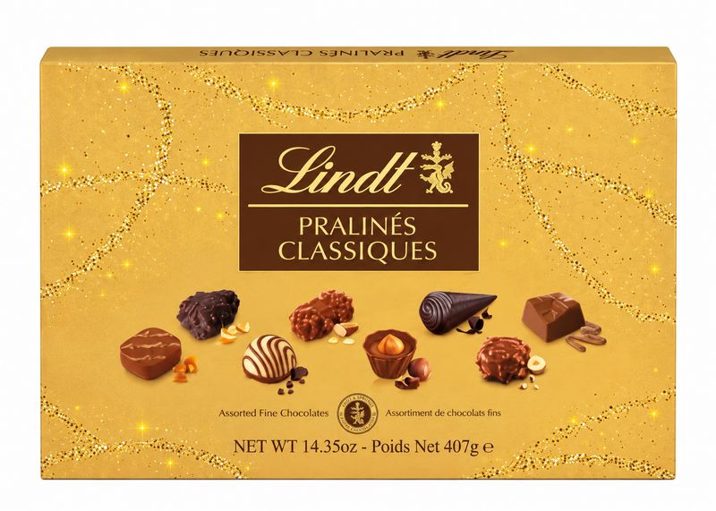 Lindt Pralines Classiques 407g gold gift box of assorted milk, dark and white chocolates on a white background